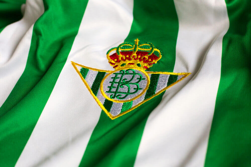 The greem emblen of the Real Betis FC portrays a crown as they are one of the Spanish teams with a royal title