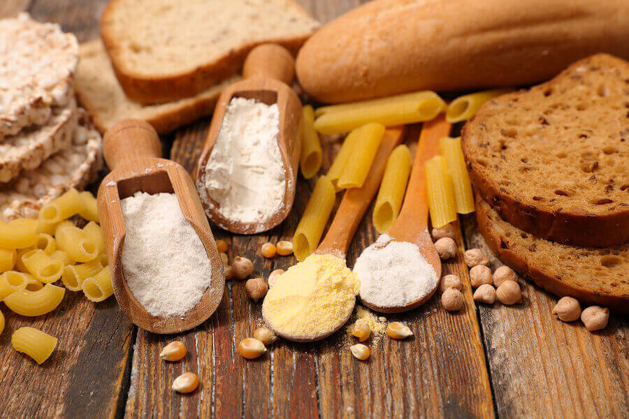 A variety of foods with high gluten content like pasta, bread and flour