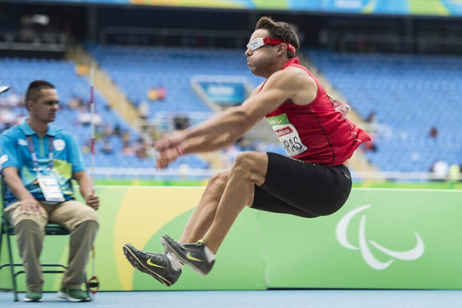 A disabled athlete participating in a Paralympic sport event organized by the Spanish Paralympic Committee