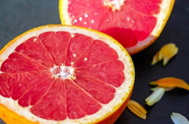 A close up shot of a pink grapefruit