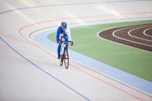 A cycling racing on a velodrome.