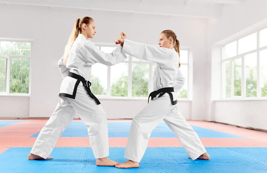Two women training for the Tokyo 2020 Karate competitions