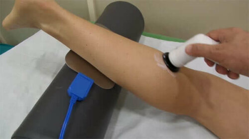 Diathermia application in a physical therapy session.