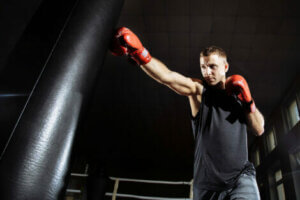 A man boxing in a gym.