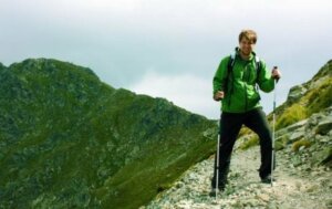 A man hiking high up on a mountain.