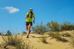 A man trail running, which is just one of many desert adventure sports.