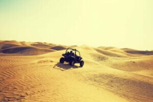 A quadbike driving through the desert.