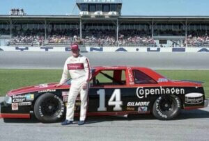 AJ Foyt stood next to his car.