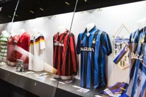 Italian football shirts in a display cabinet.