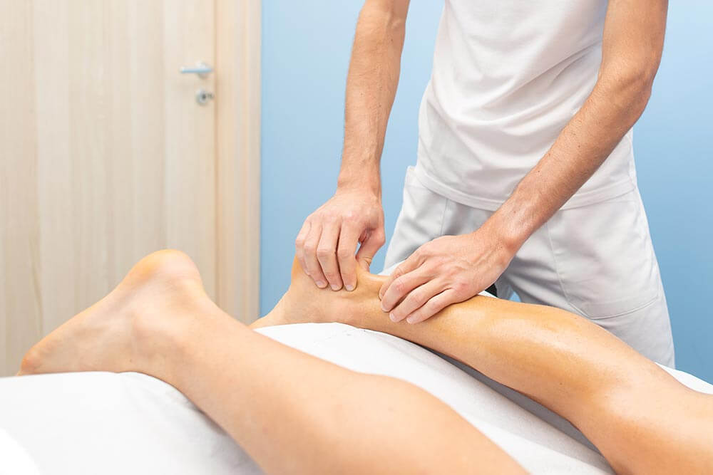 A person getting physical therapy to recover from an Achilles heel rupture
