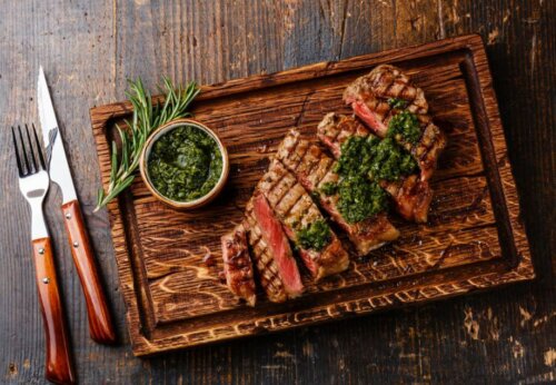 A steak on a cutting board.