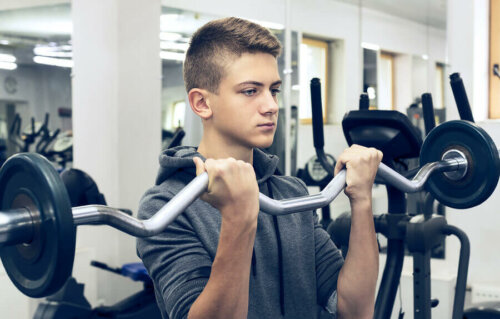 A young man training his biceps.
