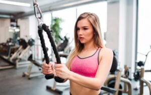 A woman working out at the gym.