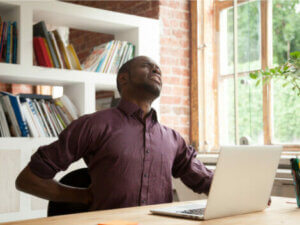 A man experiencing a muscle spasm.