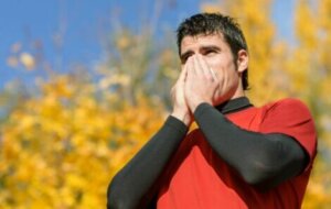 A runner suffering from allergies whilst outside.