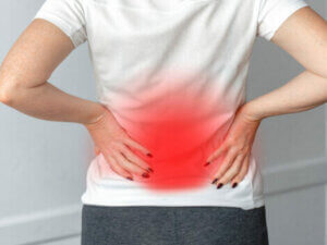 A woman with lower back pain.