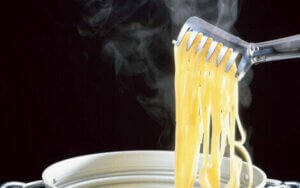 Pasta being lifted from the pan.