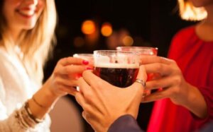 Three people toasting at a party.