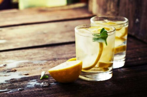 Two glasses of lemon water.