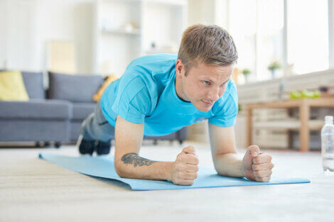 A man doing bodyweight tricep extensions to strengthen his arms