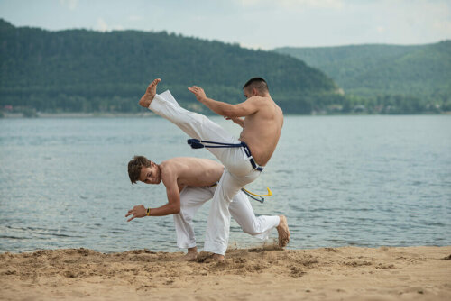 Two men practicing Capoeira.