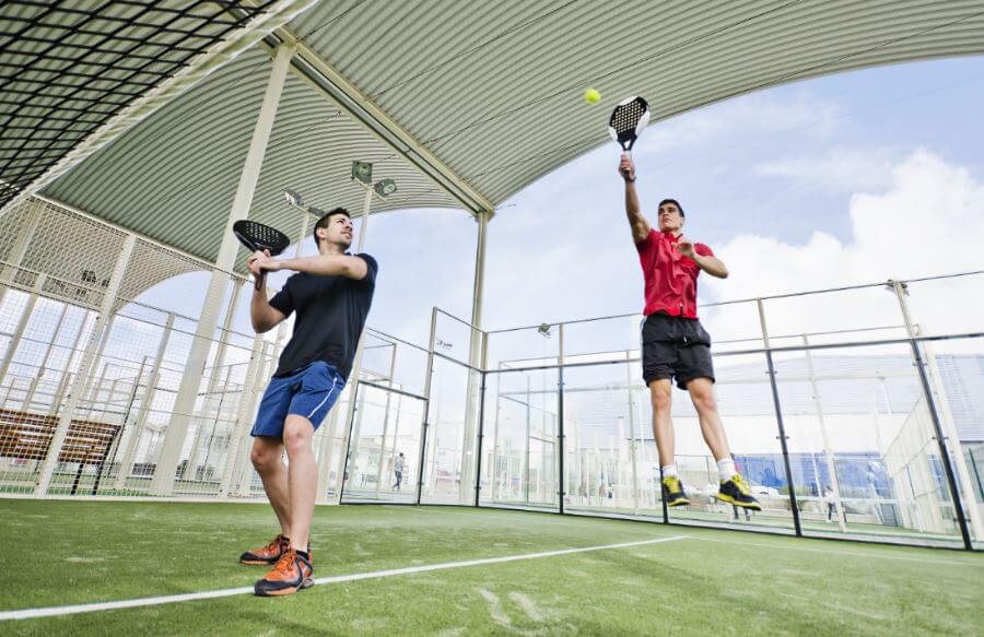 Two men playing tennis.