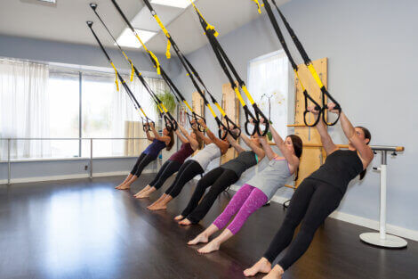 A group doing TRX rows