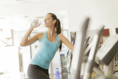 A woman drinking water.