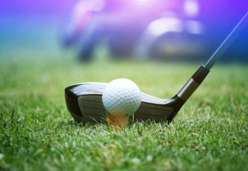 A golf club on a tee.