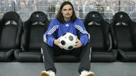 Lutz Pfannenstiel holding a football.