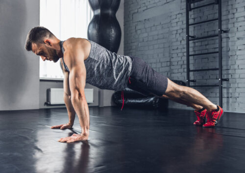 A man doing a push-up.