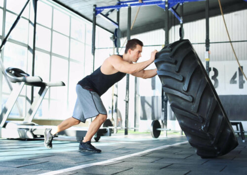 A man training with a tire.