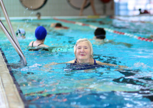 An old woman swimming.