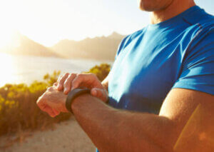A man checking his fitness watch.