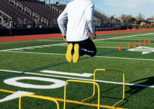 A man training on a football field.