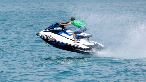 A man racing on a jet ski