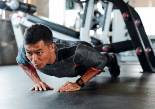 A man doing a diamond push-up.