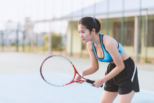 A woman playing tennis.