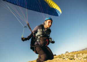 A man paragliding.