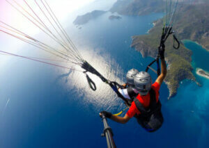 Two people paragliding.