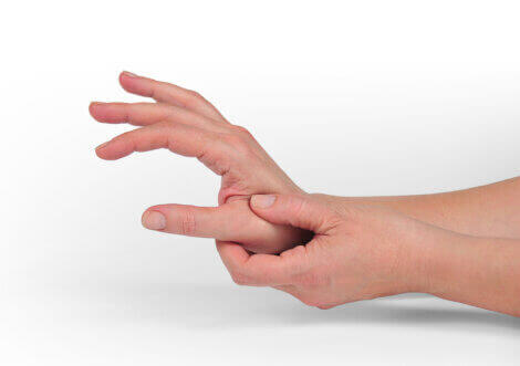 A person rubbing their hand.