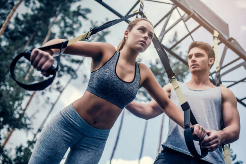 A woman training with TRX.