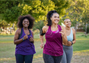 A group of women running in the park.