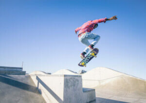 A man doing tricks on his skateboard.