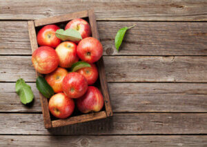 Red apples in a crate.