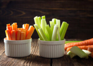 Some ramakins containing celery and carrots.