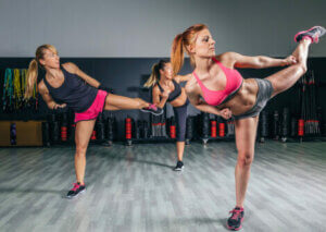 Three women in a body combat class.
