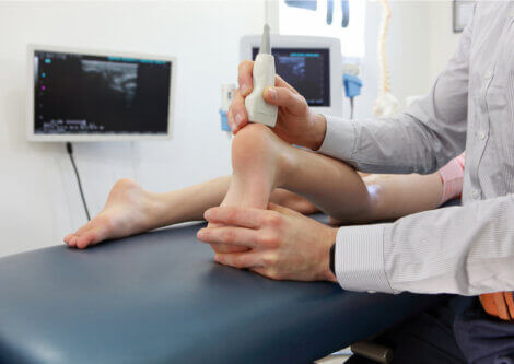 A doctor treating Achilles tendonitis.