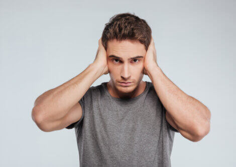 A man suffering from ear pain.