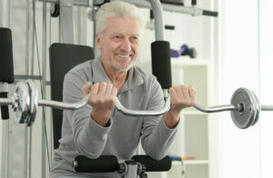 Older man lifting weights